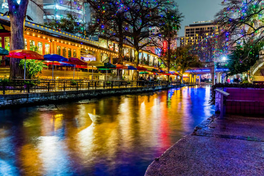 Riverwalk in san Antonio texas with lit of streets near a canal of water